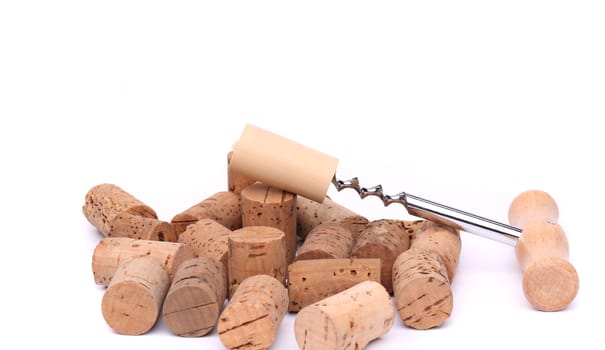 Corkscrew and wine corks on awhite background