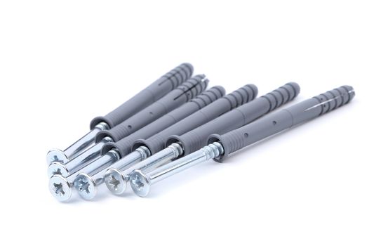Screws and dowels isolated on white background
