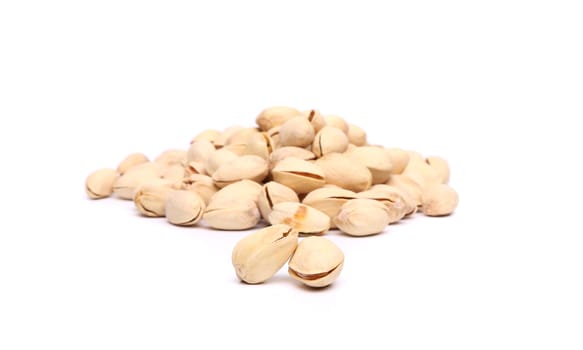 pistachios heap against of a white background