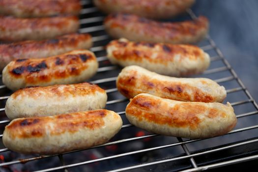 Nicely grilled sausages on a whole background