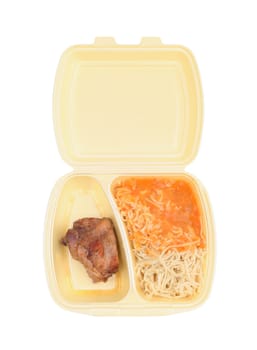 Chicken with pasta in food container on a white background