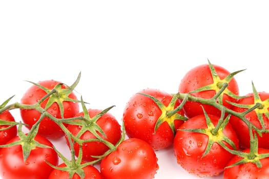 Two clusters of small red tomatoes on a branch isolated on a white background