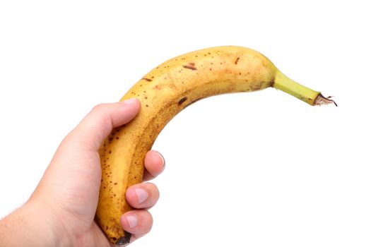 Young hand and old banana on a white background