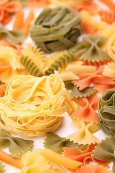 different pasta in three colors. Close-up. Background.