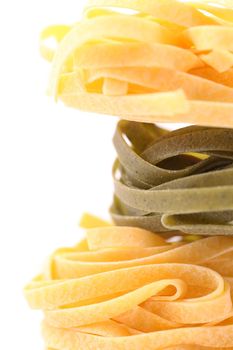 Frame of fettuccine nests on white background