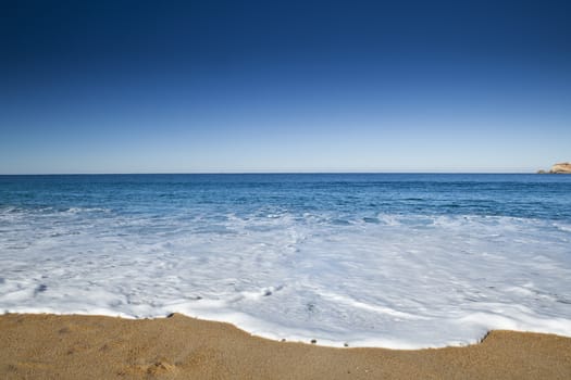 Beautiful landscape of a white sand beach from south europe