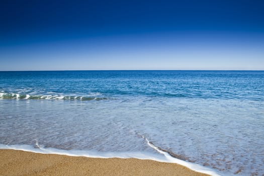 Beautiful landscape of a white sand beach from south europe