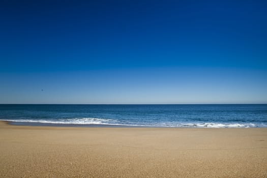 Beautiful landscape of a white sand beach from south europe