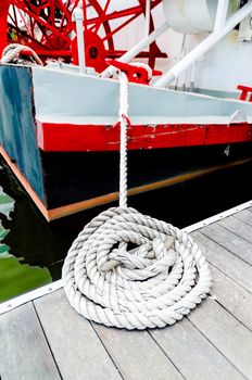 Closeup of boat tied to dock.