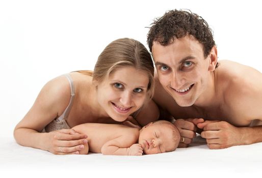 Young caucasian couple with one week old boy over white