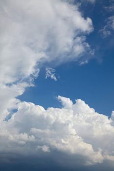 Clouds gathering in the blue sky