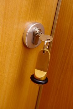 Key in the door of a hotel room