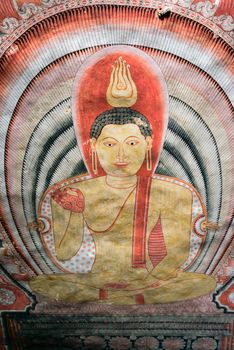 Valuable tempera paintings with Buddha image on the cave ceiling dating from the 18th century in Dambulla Cave Temple, Sri Lanka