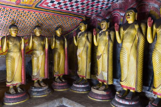 Standing Buddha statues in Dambulla Cave Temple, Sri Lanka