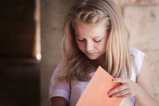 A high school girl preparing for an exame or doing her homework