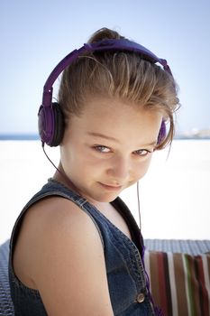Funky looking teenager wearing  headphones