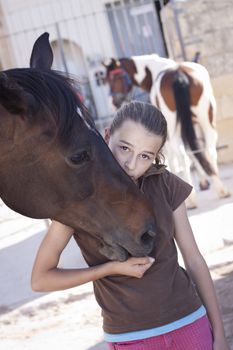 A young teenager with her horse