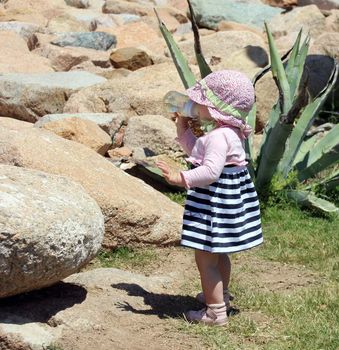 Little cute blond girl (one year and seven months of age) at the port in Porto Cervo. Sardinia