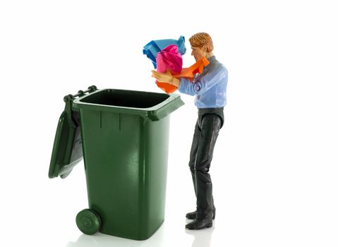 man throw old paper in green container