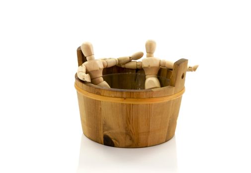 two wooden puppets together in the hottub