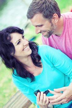 Portraite of a happy couple outdoors in the park 