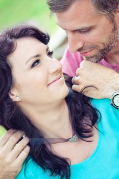 Portraite of a happy couple outdoors in the park 