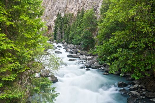 beautiful stream between rocks in Pre Saint Didier, Aosta. Italy