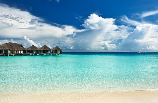 Beautiful beach with water bungalows at Maldives
