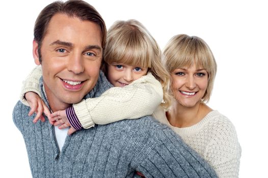 Casual portrait of a cheerful family of three