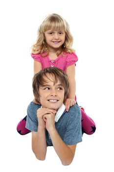 Cute girl kid sitting on her brother's back