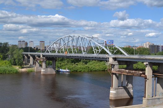 The bridge on Chellyuskintsev St. through the river "Tura" Tyumen