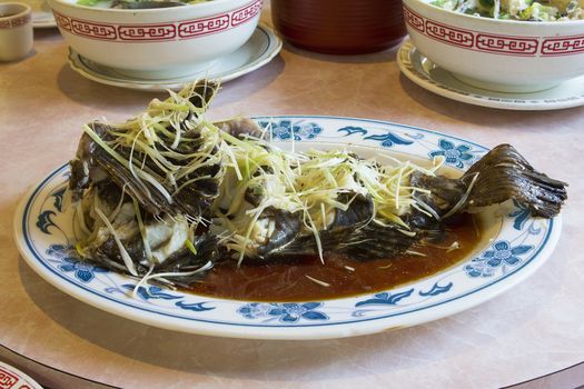 Steamed Whole Fish Chinese Dish with Ginger Scallions and Soy Sauce