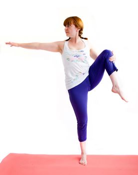 middle aged redhead woman exercising yoga isolated on white