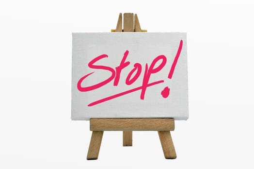 An easel with sign stop