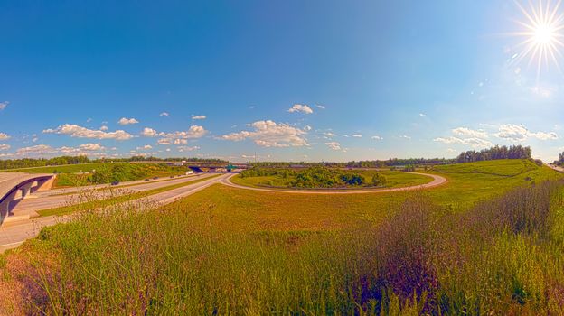 clover leaf exit ramps on highway near city