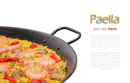 Closeup of traditional spanish paella cooked in a pan, isolated on white background