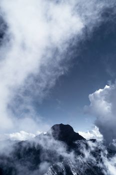 Mountain scenery with clouds and mist, the peak is famous Mt Jade in Taiwan, Asia. Mt Jade is the highest mountain in Taiwan and belong Yushan National park. This images was shoot as IR photo by Nikon D5000 and IR720nm.