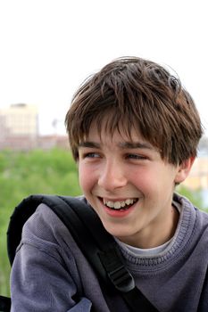 Smiling boy student feel early vacation