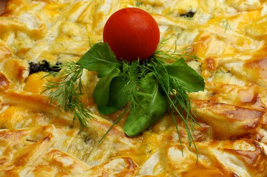 Background of Cheese and Greens Puff Pastry Pie with Cherry Tomato closeup