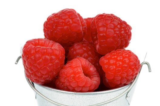 Perfect Ripe Raspberries in Cap of Tin Bucket isolated on white background