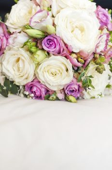 Close-up of wedding bouquet made of white and pink roses