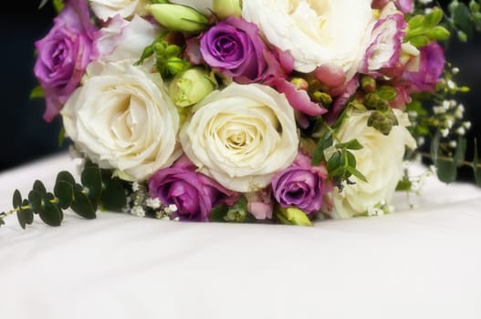 Close-up of wedding bouquet made of white and pink roses