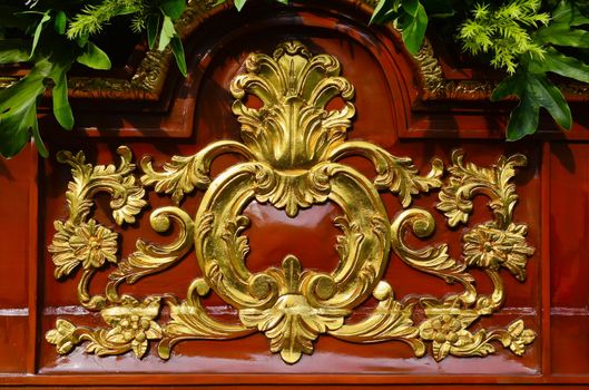 Closeup of side of statue carriage during a Catholic feast procession.