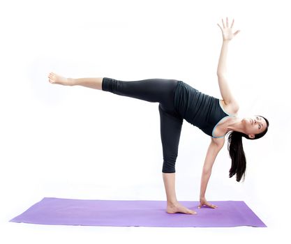 young brunette girl practising yoga isolated on white