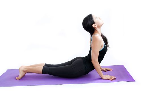 young brunette girl practising yoga isolated on white