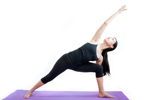 young brunette girl practising yoga isolated on white