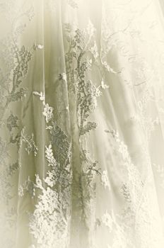 Close up of vintage white wedding gown