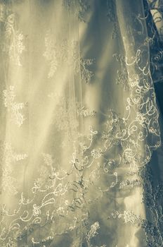 Close up of vintage white wedding gown