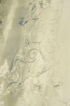 Close up of vintage white wedding gown