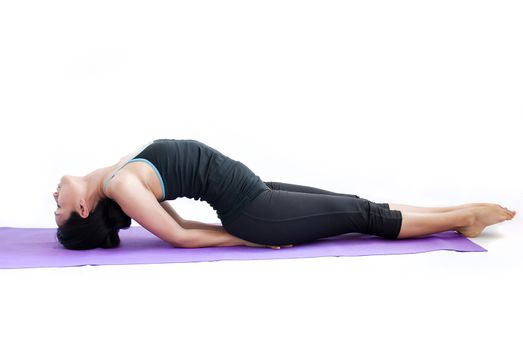 young brunette girl practising yoga isolated on white